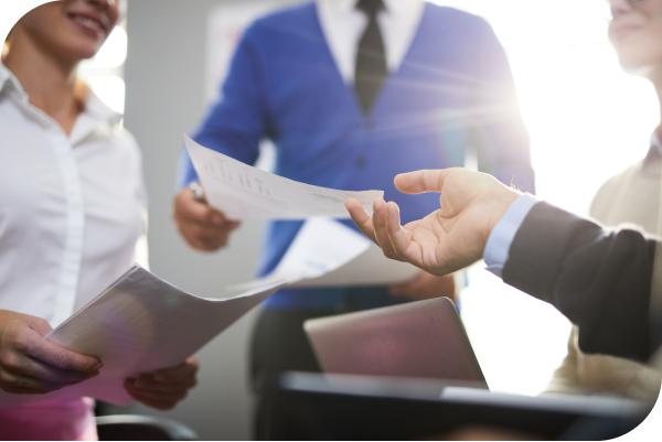 Group of professional business people sharing a document